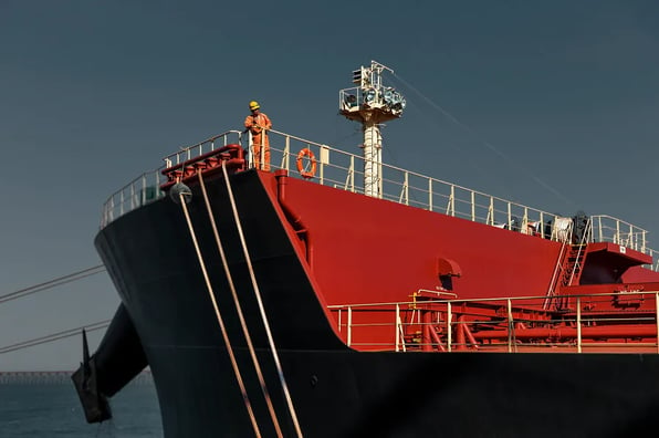 A crew member on the deck of a ship